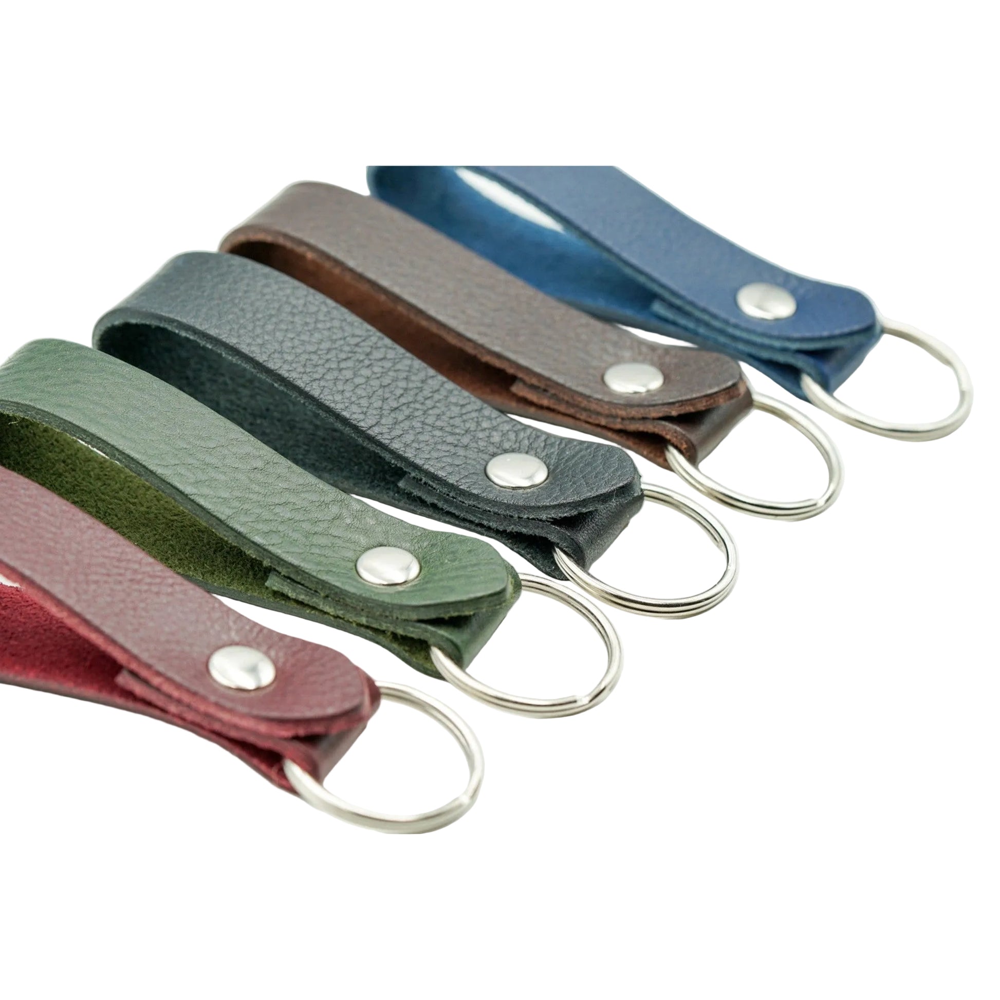 Set of leather keychains in various colors on a white background