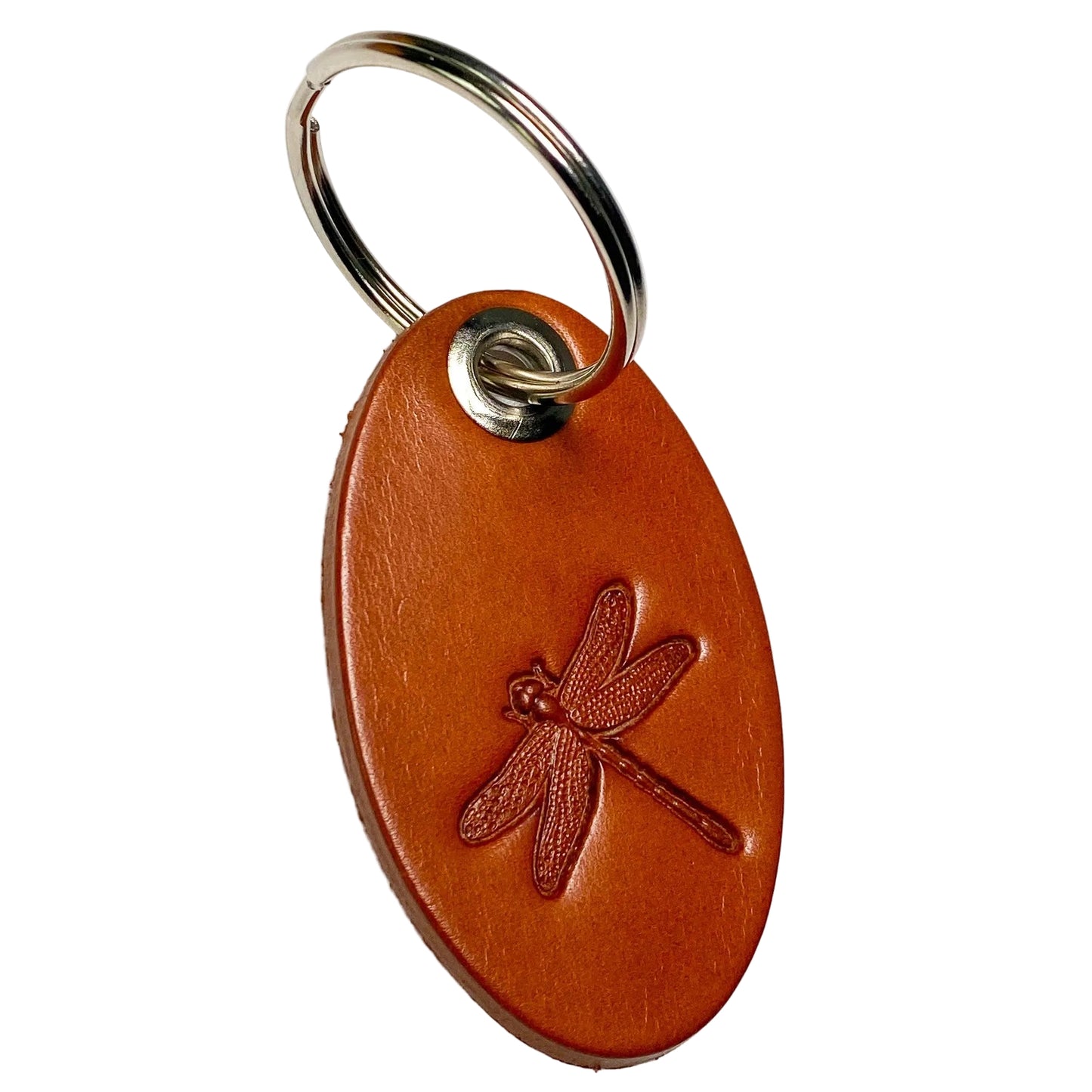 Brown leather keychain with embossed dragonfly design on a white background
