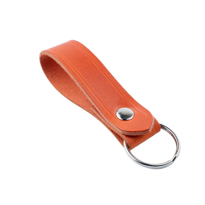 Orange leather keychain with a metal ring on a WHITE background