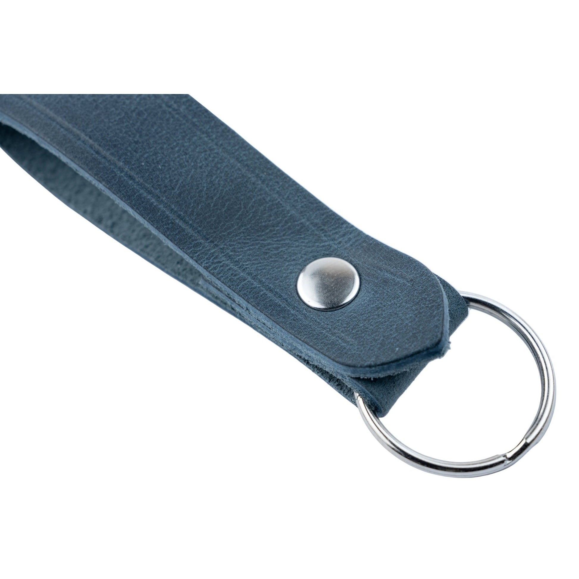 Close-up of a blue keychain with a metal ring on a white background